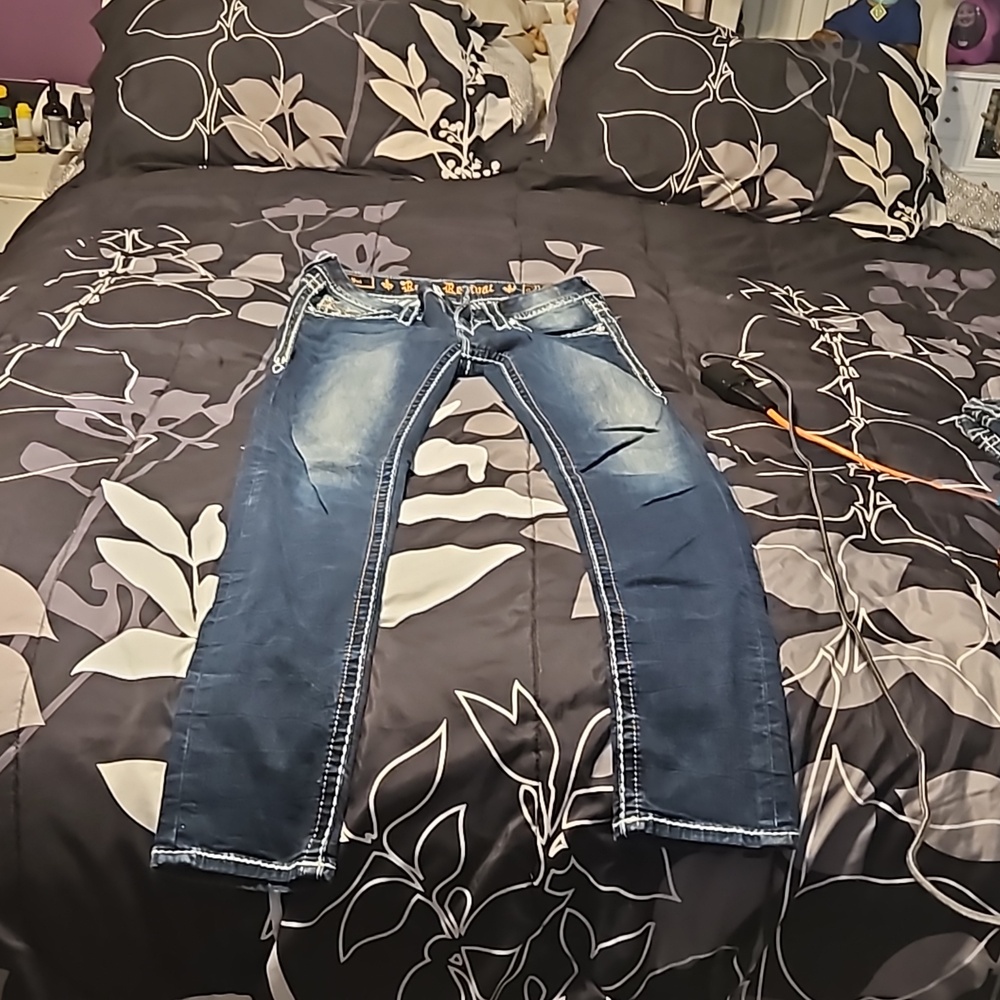 A pair of Size 27 Rock Revival skinny jeans